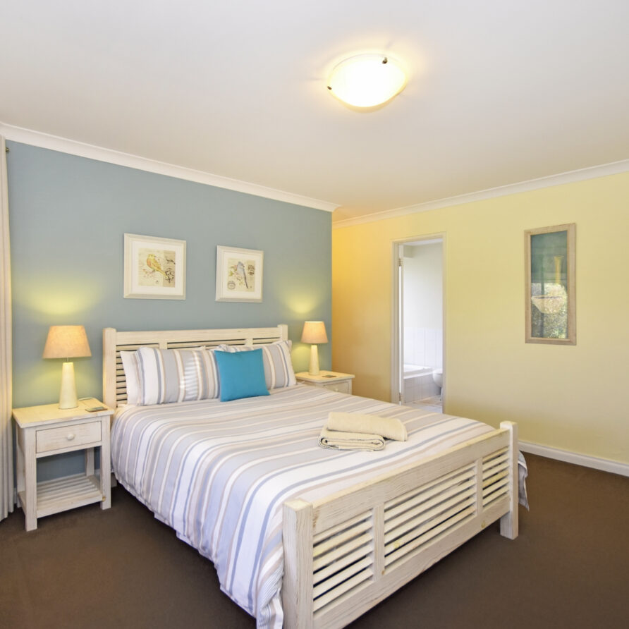 Queen bed in master bedroom at castaway  perth holiday stays Queen bed in master bedroom at castaway