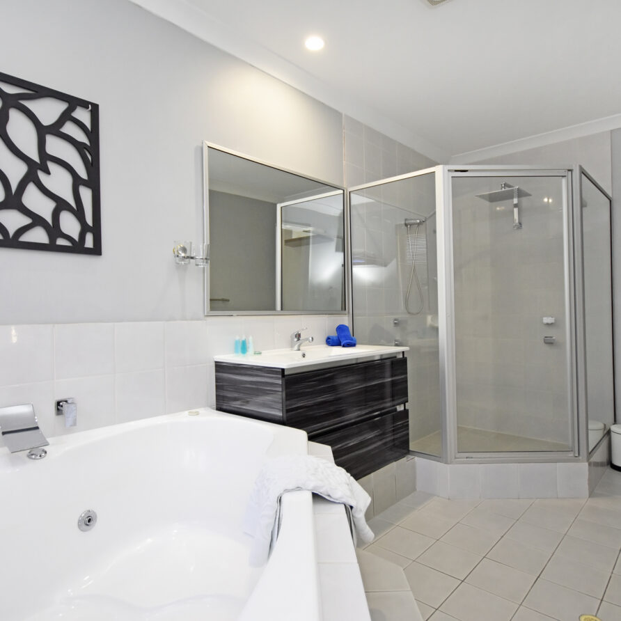 Ensuite with spa bath vanity shower and w C  perth holiday stays Master bedroom ensuite