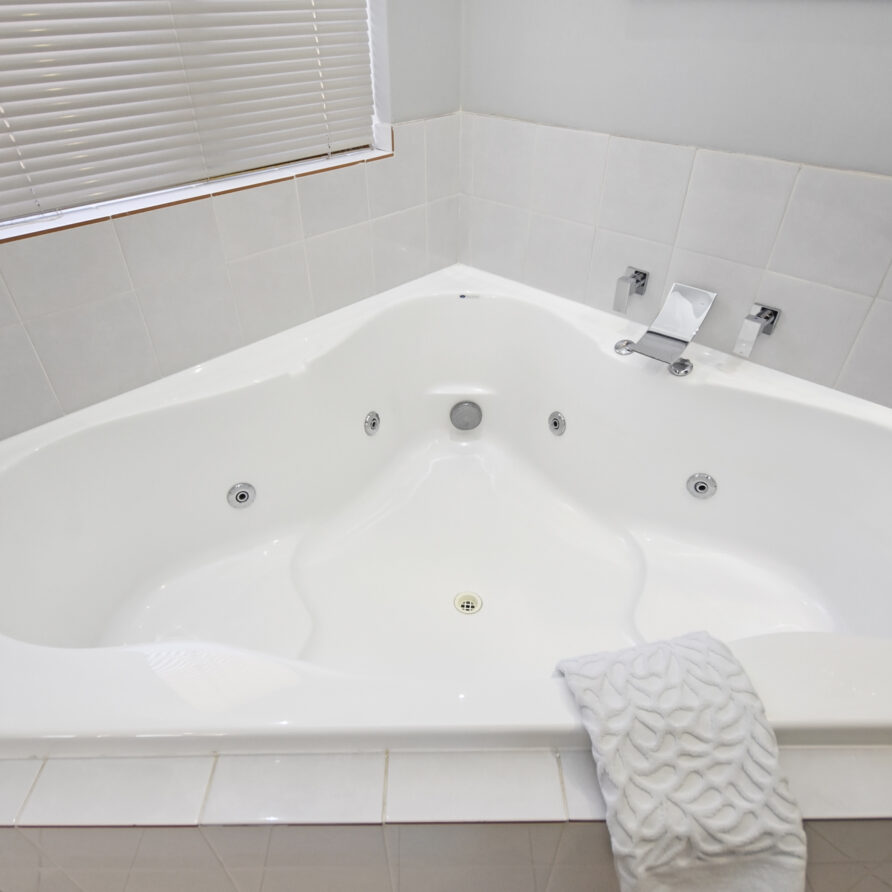 Spa bath in ensuite  perth holiday stays Corner spa bath located in ensuite
