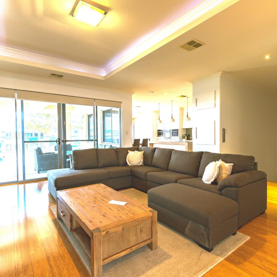 Large lounge area with ample seating  perth holiday stays Large lounge with ample seating and access to balcony