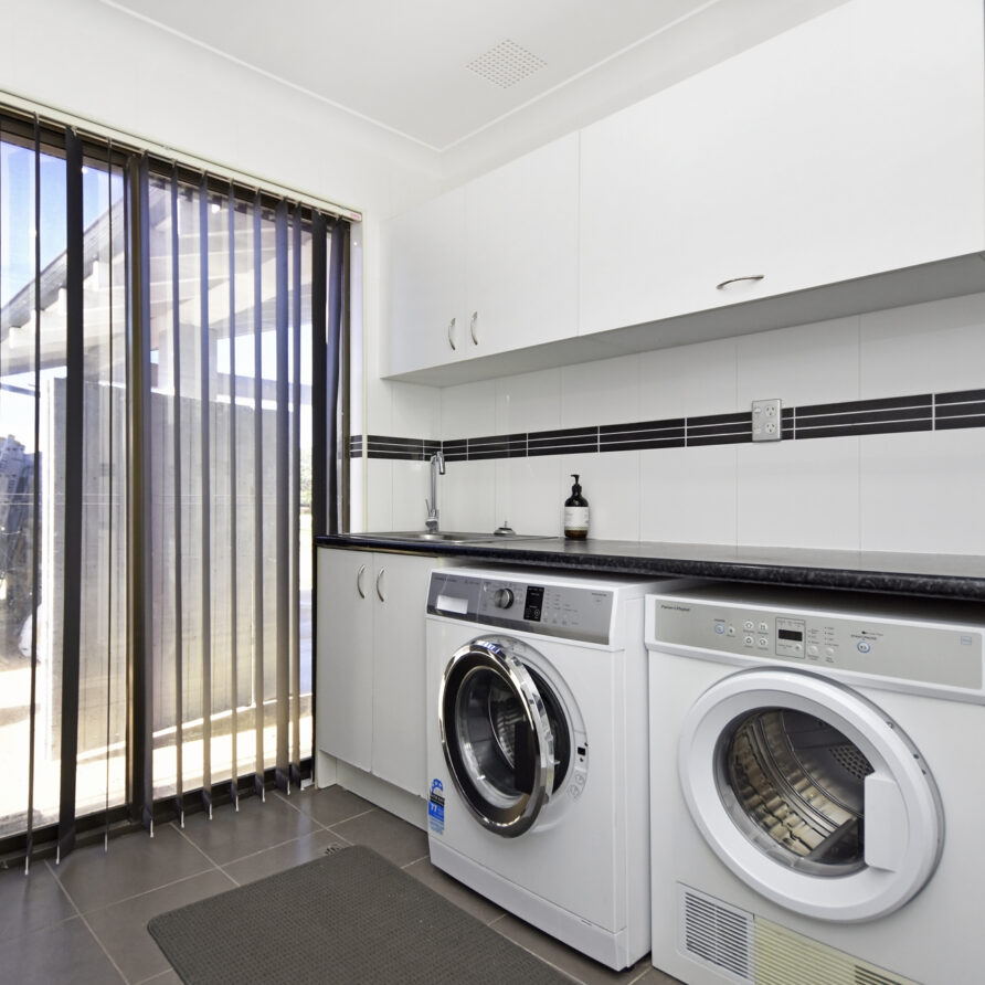 Laundry room with washing machine and tumble dryer  perth holiday stays